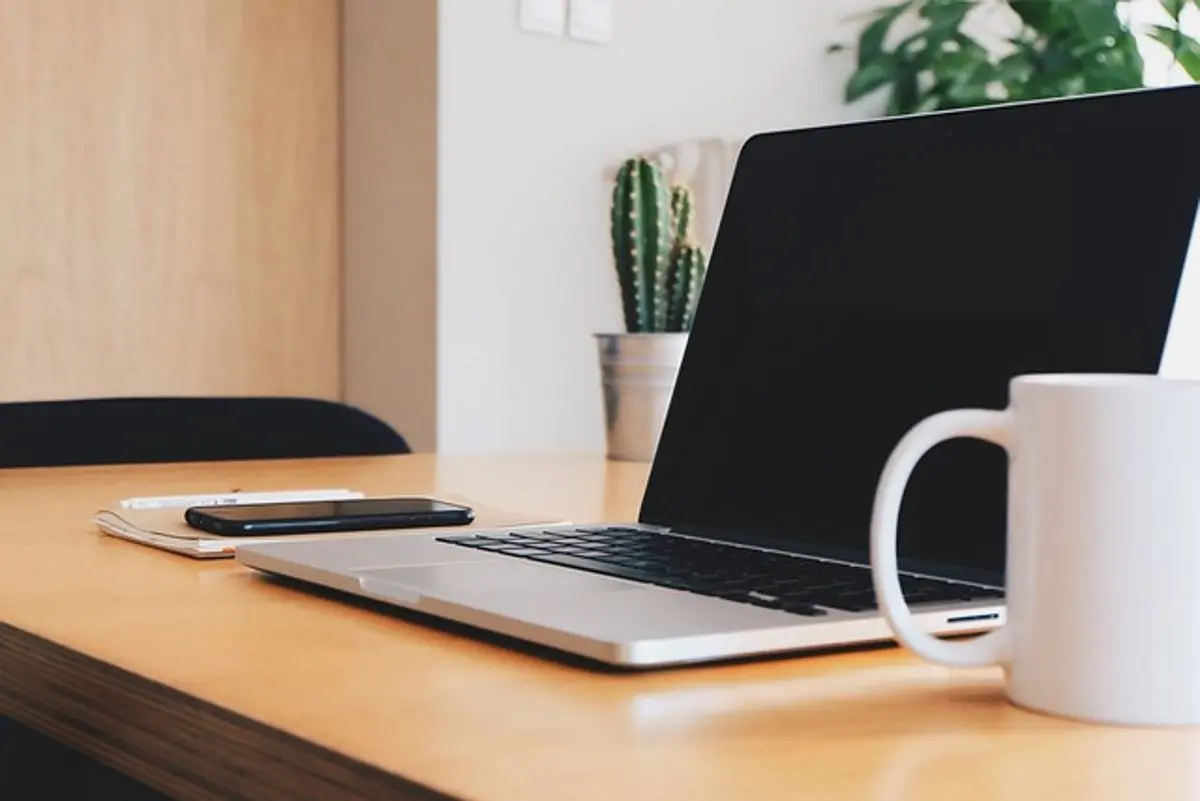 laptop-smartphone-and-cup-of-coffee-on-a-desk