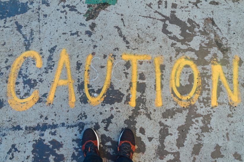 word-caution-written-with-spraypaint
