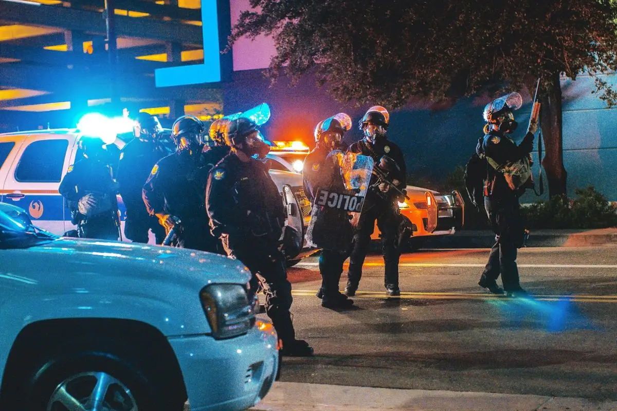 Police officers in raid gear.