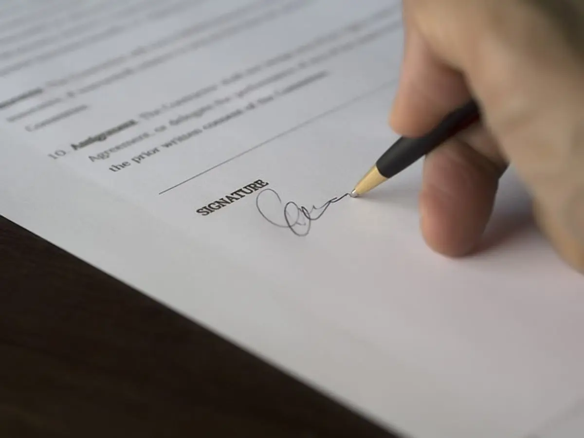 person-signing-an-agreement