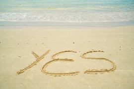 word-yes-written-on-sand