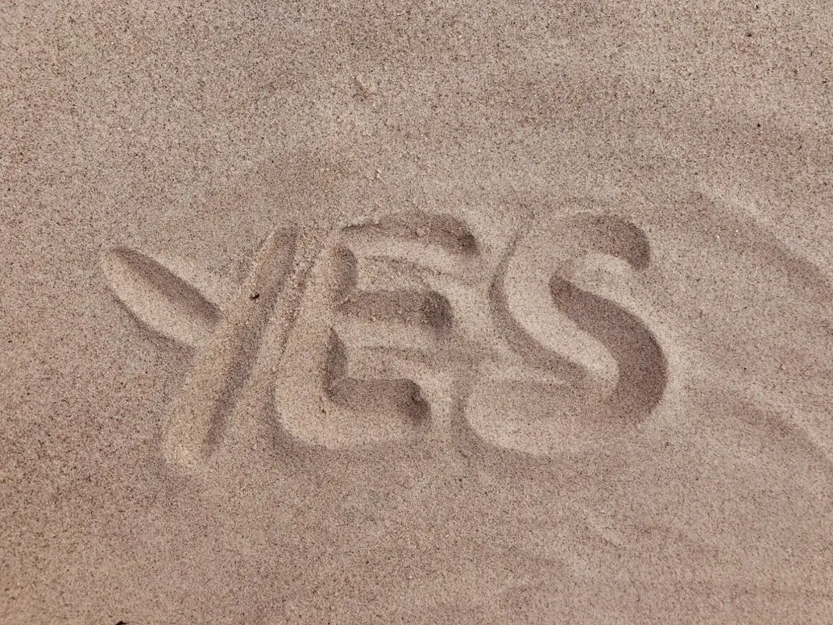 A Yes sign in the sand.