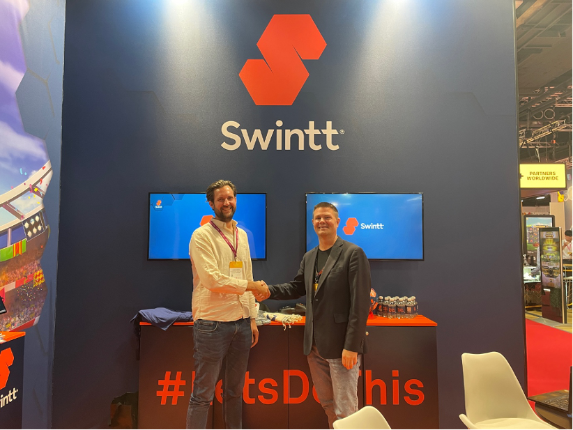 swintt-light-and-wonder-executives-handshake