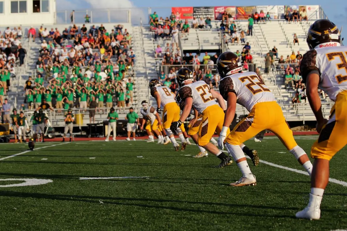 Students playing football.