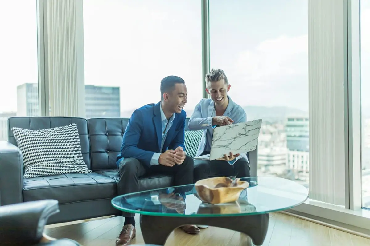 Two people discussing business results.