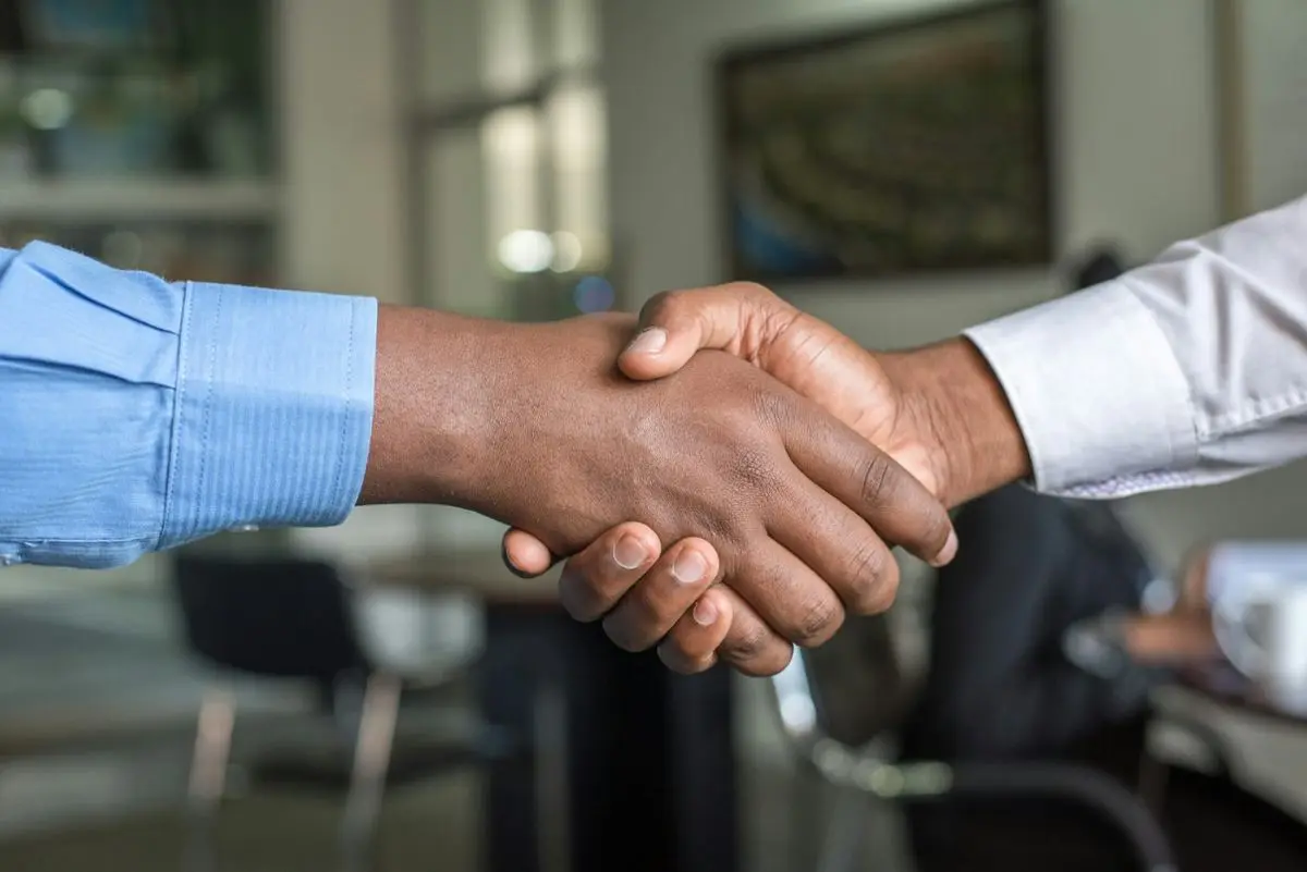 Agreement with two people shaking hands