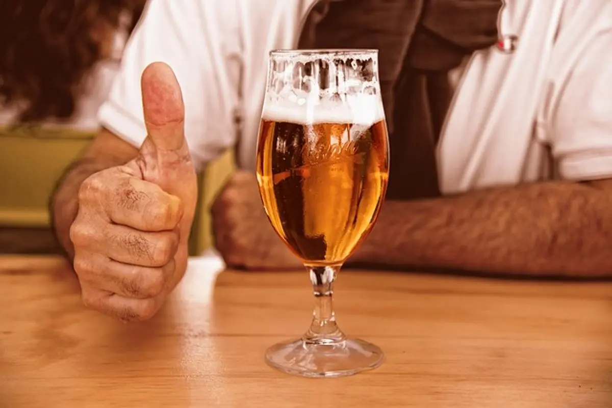 beer-jug-and-person-holding-a-thumb-up