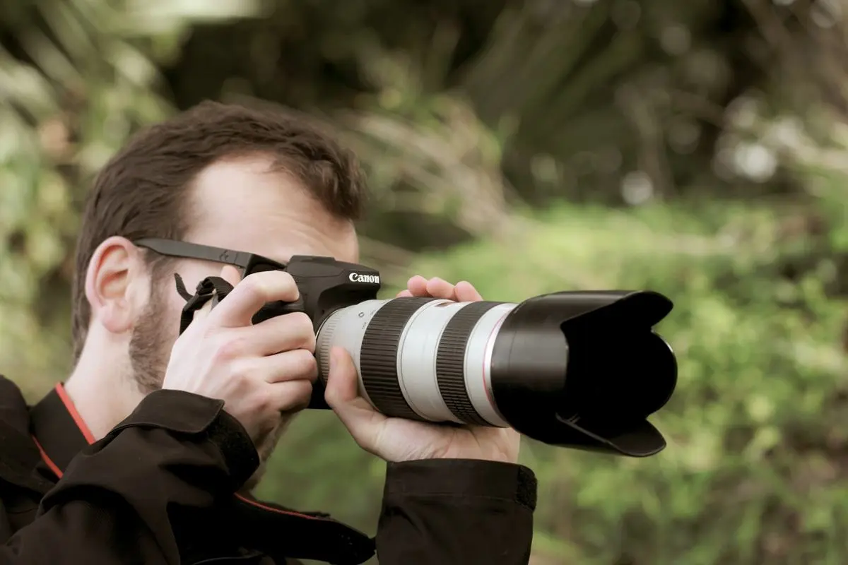 A person taking a photo with a professional camera